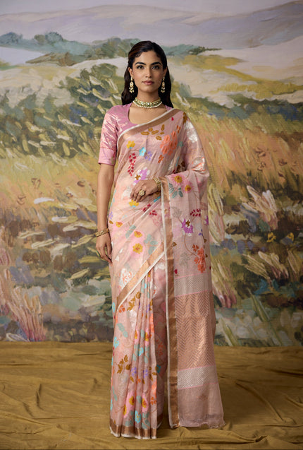 Luxury ivory handwoven Kota gold tissue saree with pastel floral jaal, silver zari stems, silver zari chevron pallu, minimal zari border and premium festive designer craftsmanship by Sonchiraiya