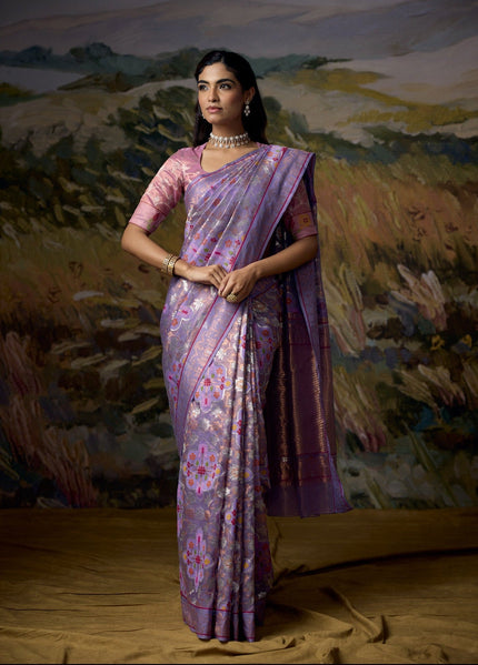 Luxury lavender handwoven Kota tissue saree with gold and silver zari floral jaal, multicolour geometric motifs, decorative deer pallu, gold tissue chevron weave, Jamdani-inspired border and premium festive designer craftsmanship by Sonchiraiya