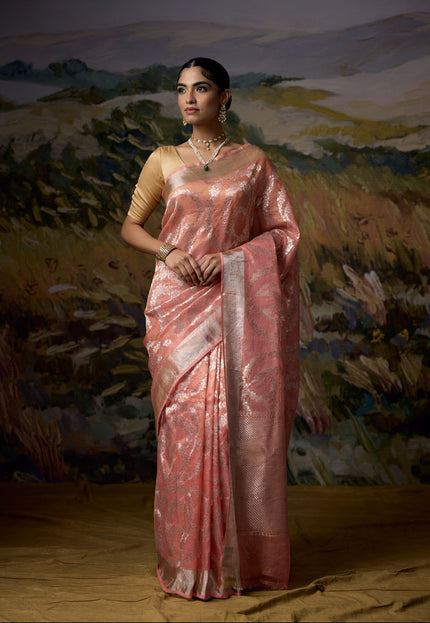 Luxury peach handwoven Kota tissue saree with silver zari rose sphere motifs, gold tissue weave, silver zari chevron pallu, minimal zari border and premium festive designer craftsmanship by Sonchiraiya