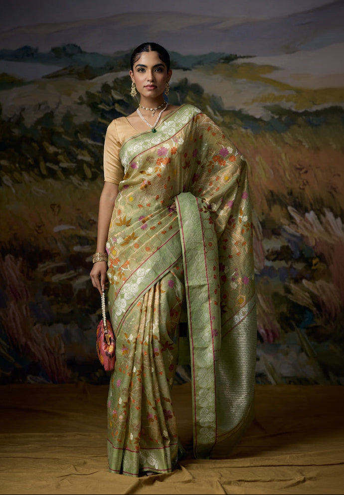 Luxury premium avocado green single tissue saree with multicolor Chinese floral motifs, silver zari stems, gold zari honeycomb pattern and elegant silver zari pallu, designer festive wedding and premium ethnic wear saree for women