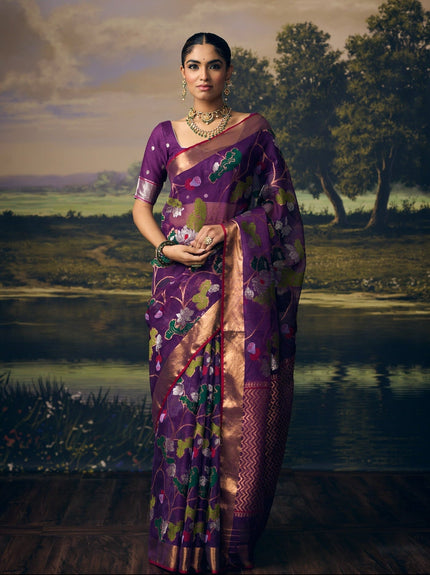 Luxury purple handwoven Kota saree with silver zari lotus jaal, gold zari detailing, crimson floral accents, gold zari chevron pallu, minimal zari border and premium festive heritage designer craftsmanship by Sonchiraiya