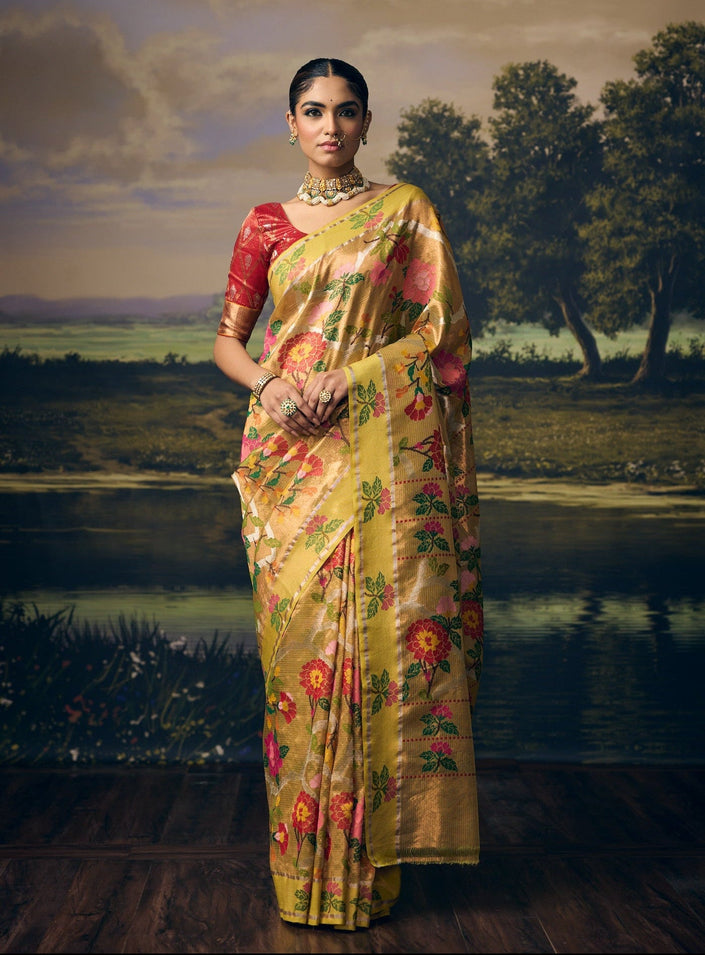 Luxury parrot green handwoven Kota double tissue saree with multicolour floral jaal, rose and marigold motifs, silver zari creepers, marigold floral pallu, contrast lemon floral border and premium festive heritage designer craftsmanship by Sonchiraiya