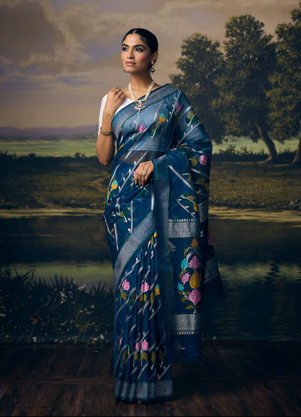 Luxury royal blue handwoven Kota saree with silver zari Laheriya weave, multicolour floral motifs, silver zari booti, statement floral pallu, minimal silver border and premium festive designer craftsmanship by Sonchiraiya