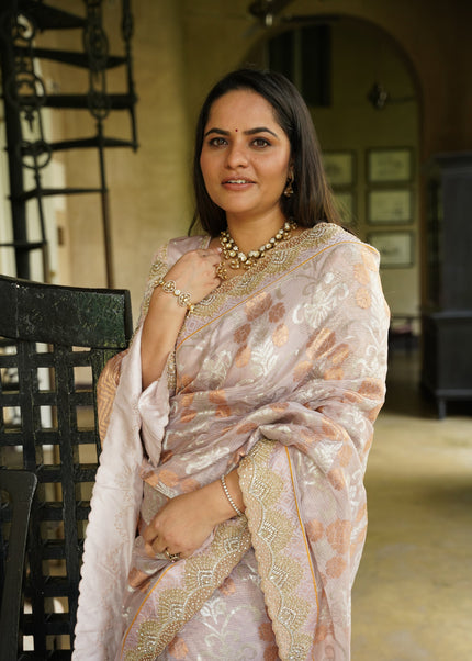 Luxury rose petal pink handwoven Kota tissue saree with gold zari floral buta weave, pastel aqua floral vines, gold zari chevron pallu, Jamawar geometric border and premium festive heritage designer craftsmanship by Sonchiraiya