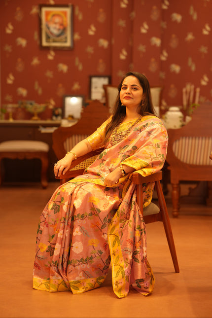 Luxury blush pink handwoven Kota double tissue saree with multicolour floral weave, contrast yellow zari border, floral pallu, yellow contrast blouse and premium festive heritage designer craftsmanship by Sonchiraiya